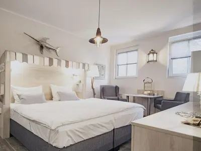 Ein Bett oder Betten in einem Zimmer der Unterkunft Ferienwohnung Strandkorb