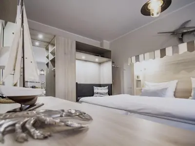 Ein Bett oder Betten in einem Zimmer der Unterkunft Ferienwohnung Strandkorb