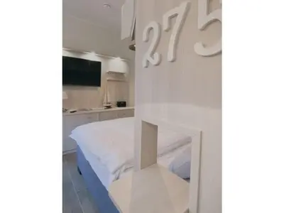 Ein Bett oder Betten in einem Zimmer der Unterkunft Ferienwohnung Strandkorb