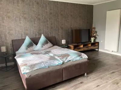 Ein Bett oder Betten in einem Zimmer der Unterkunft Ferienwohnung OstseeStrandLäufer 3