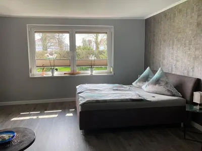 Ein Bett oder Betten in einem Zimmer der Unterkunft Ferienwohnung OstseeStrandLäufer 3