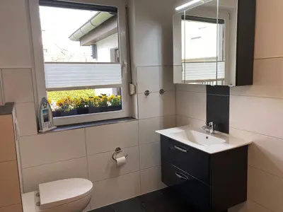 Ein Badezimmer in der Unterkunft Ferienwohnung OstseeStrandLäufer 3