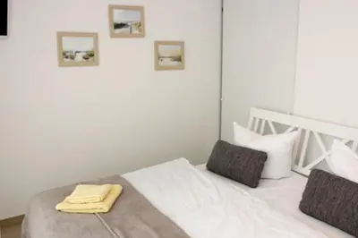 Ein Bett oder Betten in einem Zimmer der Unterkunft Käptn Brass Appartement 13