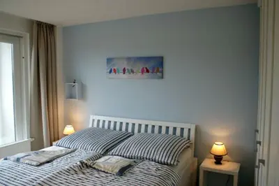 Ein Bett oder Betten in einem Zimmer der Unterkunft Käptn Brass Appartement 16