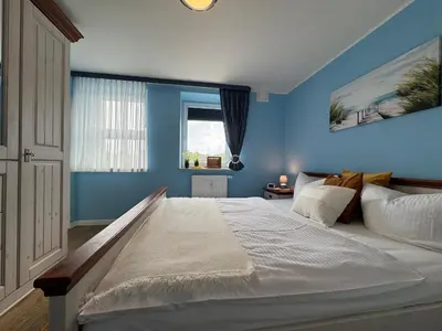 Ein Bett oder Betten in einem Zimmer der Unterkunft Käptn Brass Appartement 17 Ostseeperle
