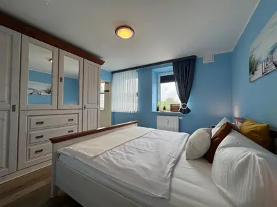 Ein Bett oder Betten in einem Zimmer der Unterkunft Käptn Brass Appartement 17 Ostseeperle