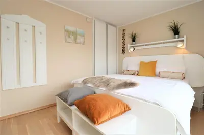Ein Bett oder Betten in einem Zimmer der Unterkunft Käptn Brass Appartement 22