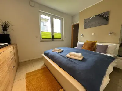 Ein Bett oder Betten in einem Zimmer der Unterkunft Käptn Brass Villa 1 App 2 Wiesenweg
