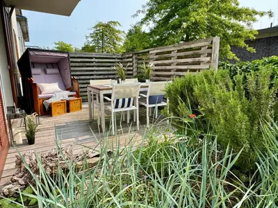 Ein Garten an der Unterkunft Käptn Brass Villa 1 App 2 Wiesenweg