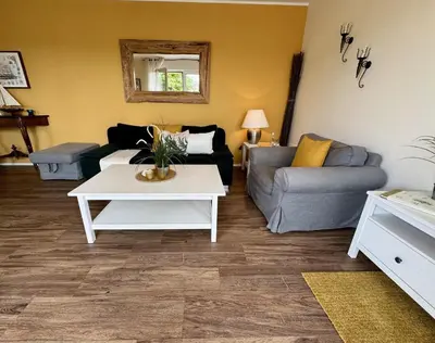 Ein Sitzbereich in der Unterkunft Käptn Brass Villa 1 App 3 Strandgut