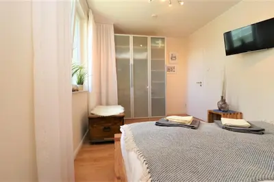 Ein Bett oder Betten in einem Zimmer der Unterkunft Käptn Brass Villa 1 App 4