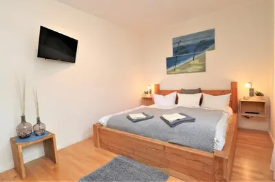 Ein Bett oder Betten in einem Zimmer der Unterkunft Käptn Brass Villa 1 App 4