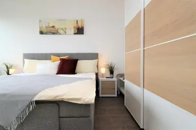 Ein Bett oder Betten in einem Zimmer der Unterkunft Käptn Brass Villa 2 App 6 Sünnsiet