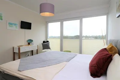 Ein Bett oder Betten in einem Zimmer der Unterkunft Käptn Brass Villa 2 App 6 Sünnsiet