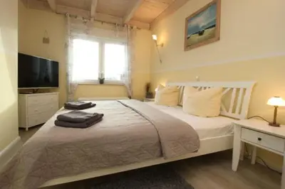 Ein Bett oder Betten in einem Zimmer der Unterkunft Käptn Brass Villa 2 App 7 Penthouse Ambiente