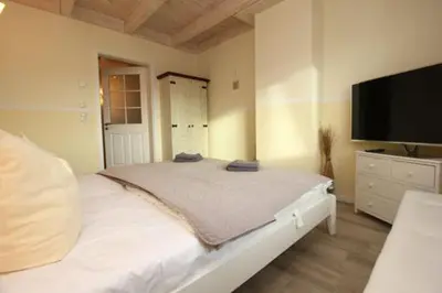Ein Bett oder Betten in einem Zimmer der Unterkunft Käptn Brass Villa 2 App 7 Penthouse Ambiente