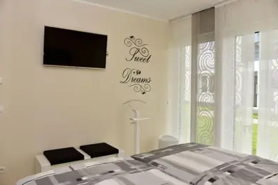 Ein Bett oder Betten in einem Zimmer der Unterkunft Käptn Brass Villa 3 App 3 Strandmuschel