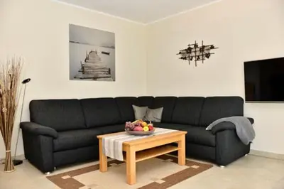 Ein Sitzbereich in der Unterkunft Käptn Brass Villa 3 App 3 Strandmuschel