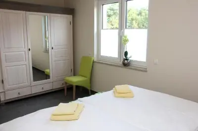 Ein Bett oder Betten in einem Zimmer der Unterkunft Käptn Brass Villa 5 App 2