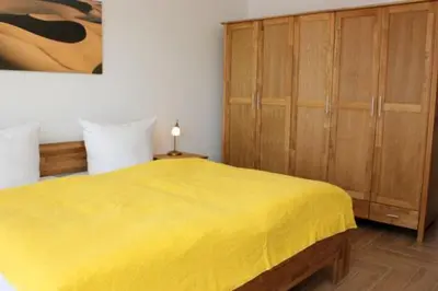 Ein Bett oder Betten in einem Zimmer der Unterkunft Käptn Brass Villa 5 App 3 Strandrose