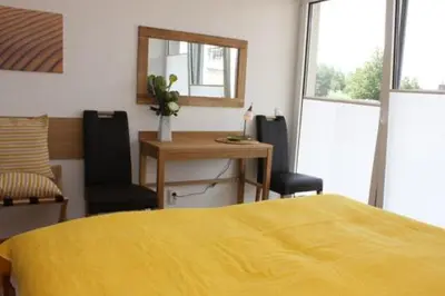 Ein Bett oder Betten in einem Zimmer der Unterkunft Käptn Brass Villa 5 App 3 Strandrose