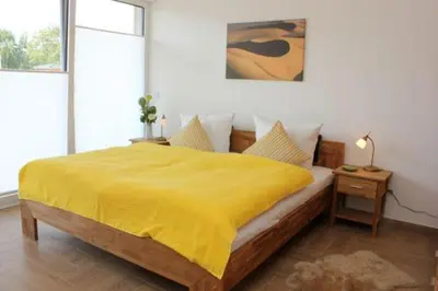 Ein Bett oder Betten in einem Zimmer der Unterkunft Käptn Brass Villa 5 App 3 Strandrose