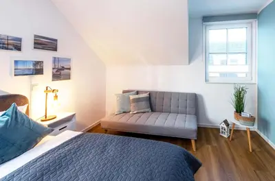 Ein Bett oder Betten in einem Zimmer der Unterkunft 5 Sterne Ferienhaus Ostseetraum - 50m zum Strand - Ladestation für E-Auto