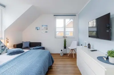 Ein Bett oder Betten in einem Zimmer der Unterkunft 5 Sterne Ferienhaus Ostseetraum - 50m zum Strand - Ladestation für E-Auto