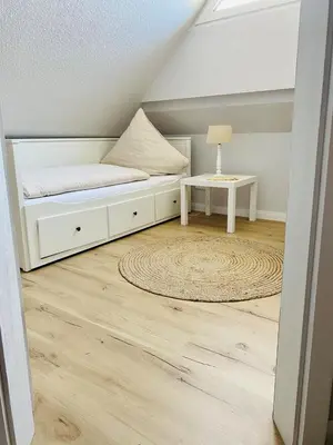 Ein Bett oder Betten in einem Zimmer der Unterkunft Strandhaus LUMA - hochwertiges Ferienhaus für 6 Personen in Strandnähe