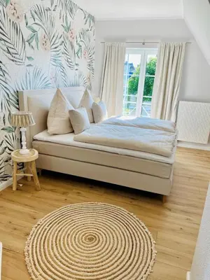 Ein Bett oder Betten in einem Zimmer der Unterkunft Strandhaus LUMA - hochwertiges Ferienhaus für 6 Personen in Strandnähe