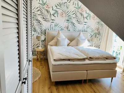 Ein Bett oder Betten in einem Zimmer der Unterkunft Strandhaus LUMA - hochwertiges Ferienhaus für 6 Personen in Strandnähe