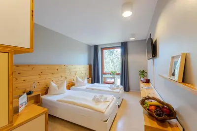 Ein Bett oder Betten in einem Zimmer der Unterkunft Hotel Garni - Haus 54