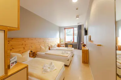Ein Bett oder Betten in einem Zimmer der Unterkunft Hotel Garni - Haus 54