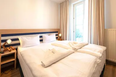 Ein Bett oder Betten in einem Zimmer der Unterkunft Modernes 5-Sterne-Apartment - Herzog Barnim