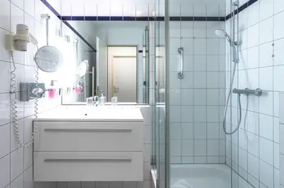 Ein Badezimmer in der Unterkunft Modernes 5-Sterne-Apartment - Herzog Barnim