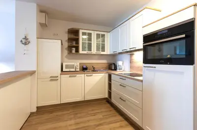 Küche/Küchenzeile in der Unterkunft Modernes 5-Sterne-Apartment - Herzog Barnim