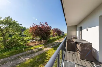 Ein Balkon oder eine Terrasse in der Unterkunft Wiesenkieker am Ostseestrand - Gemütliche Unterkunft nahe Strand & Dünen