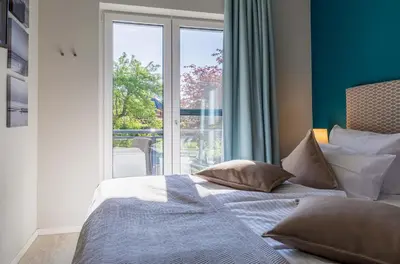 Ein Bett oder Betten in einem Zimmer der Unterkunft Wiesenkieker am Ostseestrand - Gemütliche Unterkunft nahe Strand & Dünen