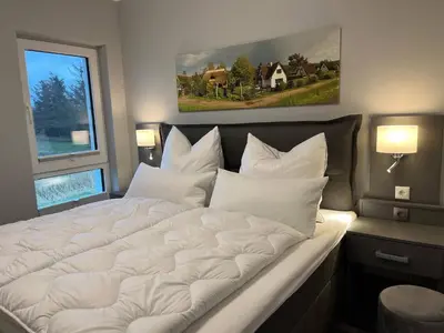 Ein Bett oder Betten in einem Zimmer der Unterkunft Boddentraum