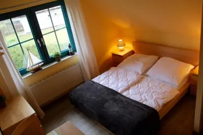 Ein Bett oder Betten in einem Zimmer der Unterkunft NEU! FeWo Graugans 600 Meter vom Strand