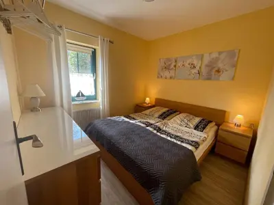 Ein Bett oder Betten in einem Zimmer der Unterkunft NEU! FeWo Sturmmöwe 600 Meter vom Strand