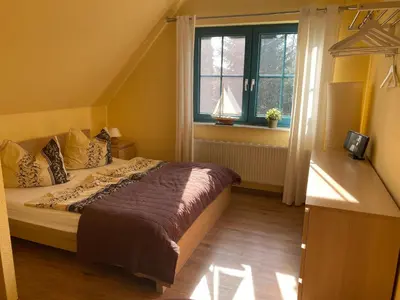 Ein Bett oder Betten in einem Zimmer der Unterkunft FeWo Austernfischer 600 Meter vom Strand