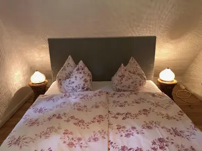 Ein Bett oder Betten in einem Zimmer der Unterkunft Apartment im Kranich Hotel