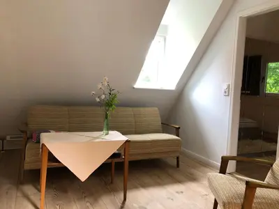 Ein Sitzbereich in der Unterkunft Apartment im Kranich Hotel
