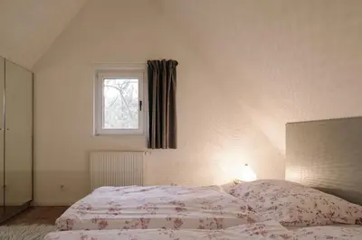Ein Bett oder Betten in einem Zimmer der Unterkunft Apartment im Kranich Hotel