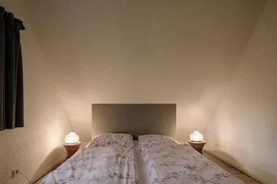 Ein Bett oder Betten in einem Zimmer der Unterkunft Apartment im Kranich Hotel