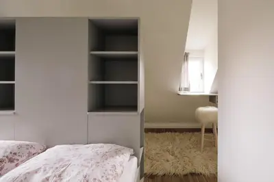 Ein Bett oder Betten in einem Zimmer der Unterkunft Apartment im Kranich Hotel