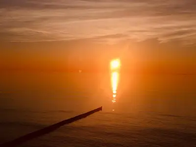 Blick auf den Sonnenuntergang/Sonnenaufgang von der Ferienwohnung aus oder aus der Nähe