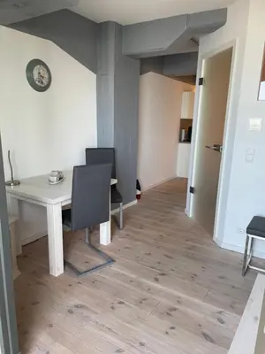 Ein Sitzbereich in der Unterkunft Apartment Boddenkieker