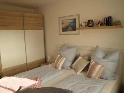Ein Bett oder Betten in einem Zimmer der Unterkunft FW Lotse